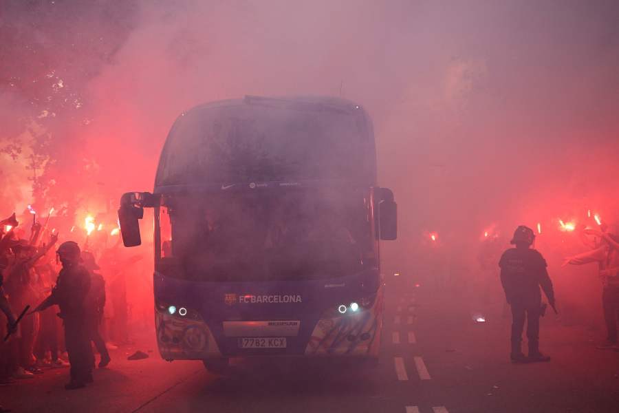 Supporters light flares as Barcelona's players arrive by bus ahead of the UEFA Champions League quarter-final second leg football match between FC Barcelona and Paris SG at the Estadi Olimpic Lluis Companys in Barcelona on April 16, 2024. - AFP pic