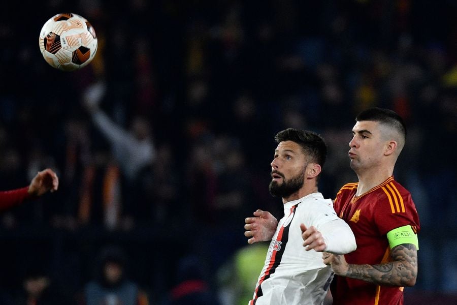 AC Milan's French forward #09 Olivier Giroud (L) fights for the ball with Roma's Italian defender #23 Gianluca Mancini during the UEFA Europa League football match between AS Roma and AC Milan at the Olympic stadium, in Rome on April 18, 2024. - AFP pic