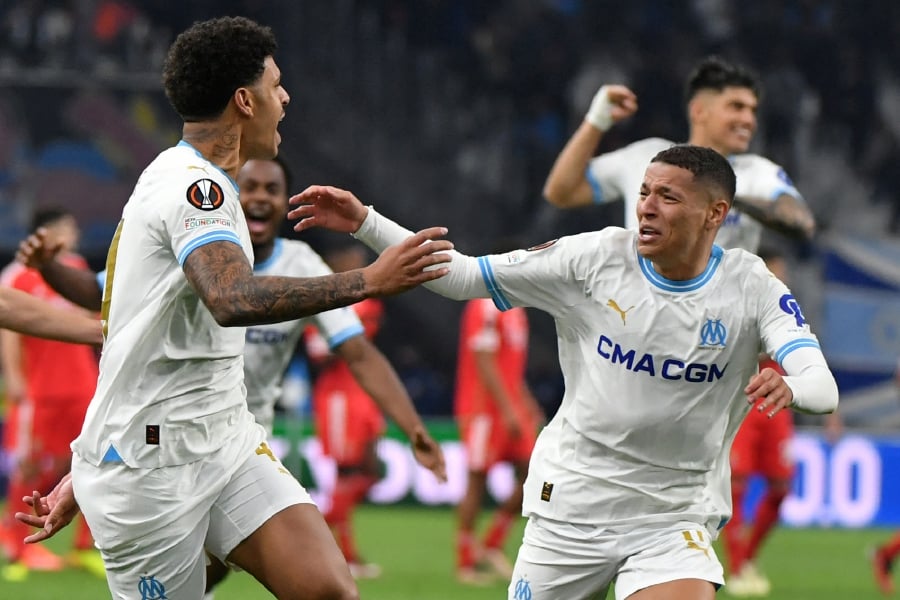 Marseille's Brazilian forward #44 Luis Henrique (L) celebrates with teammates after winning the UEFA Europa League quarter final second leg football match between Olympique de Marseille (OM) and SL Benfica at the Stade Velodrome in Marseille on April 18, 2024. - AFP pic