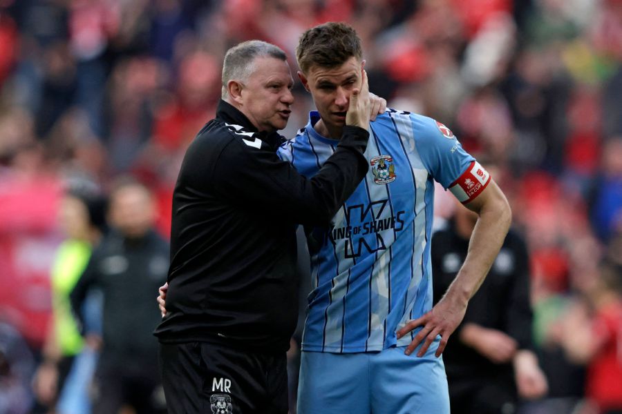 Coventry City's English manager Mark Robins (L) consoles Coventry City's English midfielder #14 Ben Sheaf (R) after the English FA Cup semi-final football match between Coventry City and Manchester United at Wembley Stadium in north west London on April 21, 2024. - AFP pic
