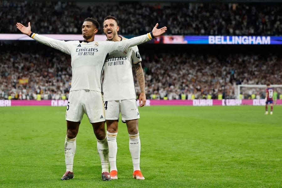 Real Madrid's English midfielder #5 Jude Bellingham celebrates scoring his team's third goal, with Real Madrid's Spanish forward #14 Joselu, during the Spanish league football match between Real Madrid CF and FC Barcelona. - AFP pic