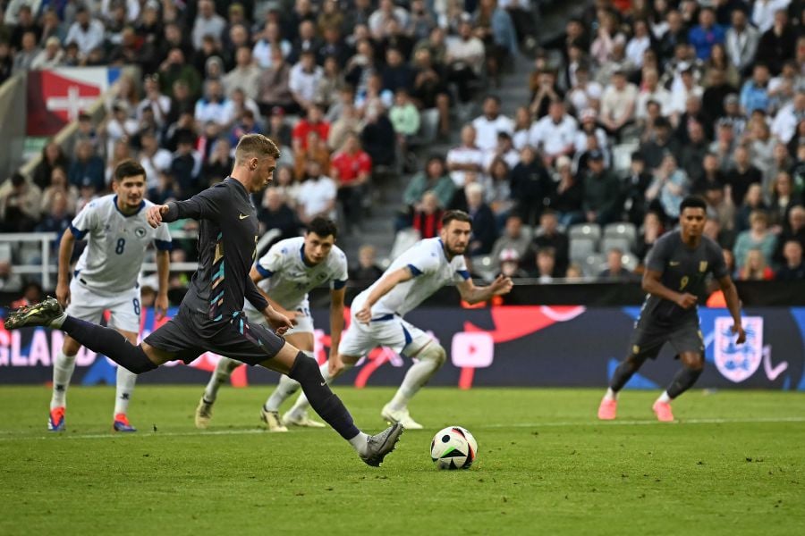 England's midfielder #07 Cole Palmer shoots from the penalty spot to score the team's opening goal during the International friendly football match between England and Bosnia-Herzegovina at St James' Park in Newcastle-upon-Tyne, north east England on June 3, 2024. - AFP PIC