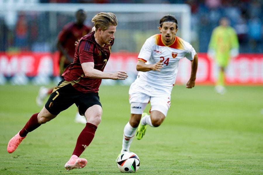 Belgium's midfielder Kevin De Bruyne (L) fights for the ball with Montenegro's midfielder Milos Brnovic during the International friendly football match between Belgium and Montenegro, at the King Baudouin Stadium (Stade Roi Baudouin - Koning Boudewijnstadion), in Brussels, on June 5 2024. - AFP PIC