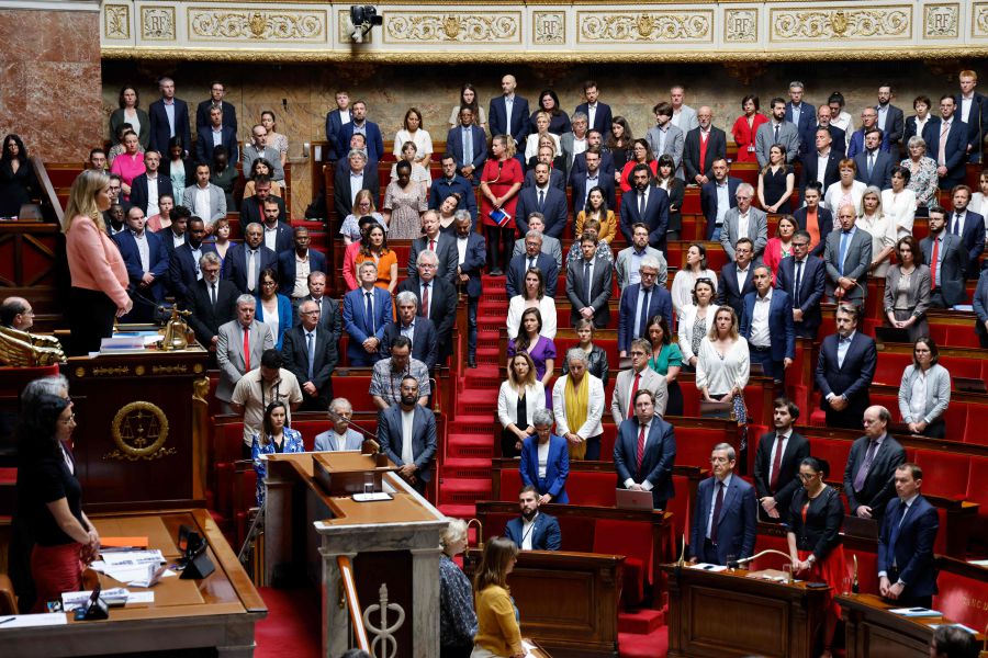 French MPs stand a minute of silence after a knife attack in Annecy, during a session of questions to the goverment to examine the Liberties, Independents, Overseas and Territories (Libertes, Independants, Outre-mer et Escritoires). - AFP Pic