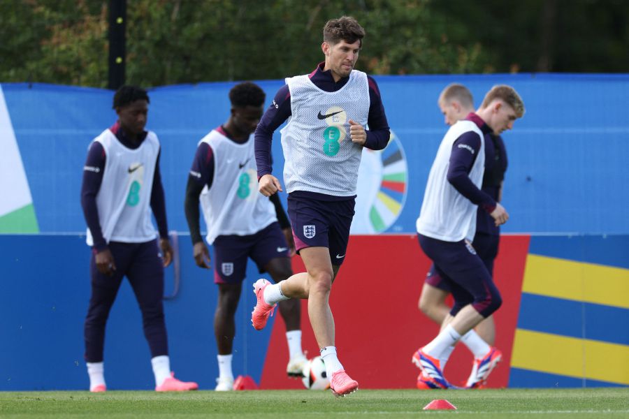 England's defender #05 John Stones runs during a training session of England's national football team, ahead of the UEFA Euro 2024 European football Championship, in Blankenhain, Thuringia, on June 13, 2024. - AFP PIC