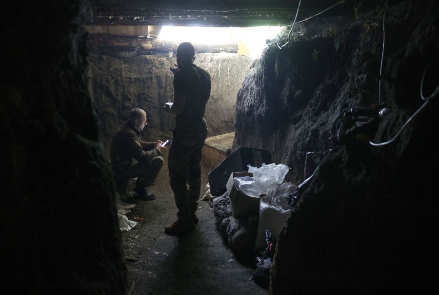 Ukrainian servicemen of the 10th Mountain Assault Brigade "Edelweiss" stand in a dugout near Bakhmut in the Donetsk region on June 13, 2023, amid the Russian invasion of Ukraine. - AFP Pic