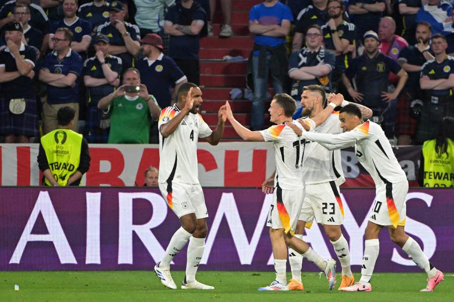 Germany's midfielder #17 Florian Wirtz (centre right) celebrates with teammates after scoring his team's first goal during the UEFA Euro 2024 Group A football match between Germany and Scotland at the Munich Football Arena in Munich on June 14, 2024. - AFP PIC