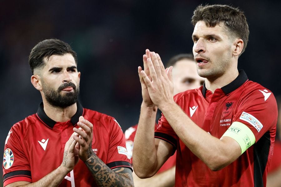 Albania's defender #04 Elseid Hisaj and Albania's defender #06 Berat Djimsiti react at the end of the UEFA Euro 2024 Group B football match between Italy and Albania at the BVB Stadion in Dortmund on June 15, 2024. - AFP PIC