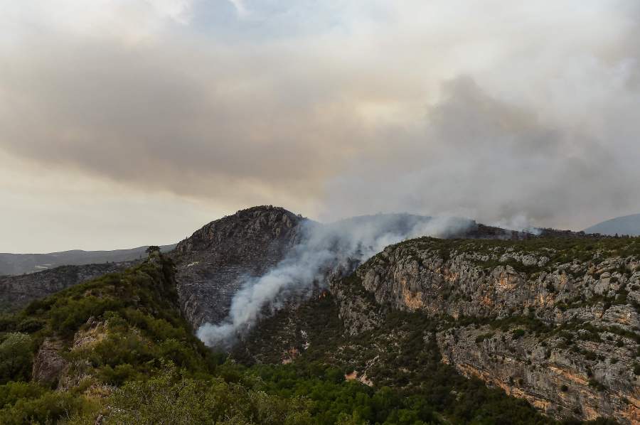Firefighters battled to bring raging wildfires under control in several parts of Spain on Saturday amid dry and windy conditions, as a heatwave pushed temperatures close to record highs. - AFP pic