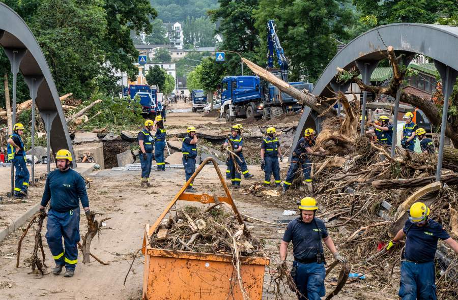 Members of the German Federal Agency for Technical Relief THW cleaning a destroyed bridge before building a replacement in Bad Neuenahr after heavy rain and floods caused major damage in the region. AFP Pic