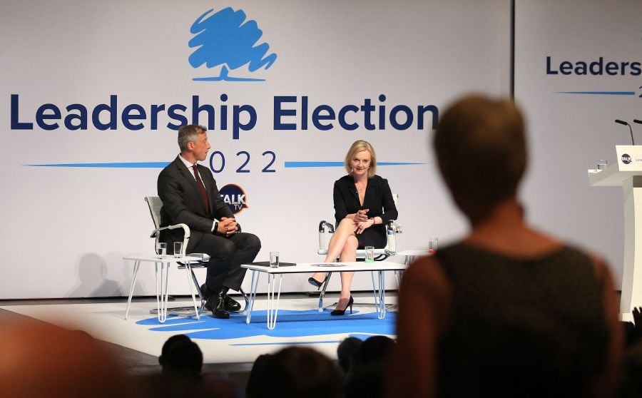 Britain's Foreign Secretary Liz Truss (C), a contender to become the country's next Prime Minister and leader of the Conservative party, answers a question from a nurse on her plans to fund the NHS, during a Conservative Party hustings event in Darlington, north east England. - AFP pic