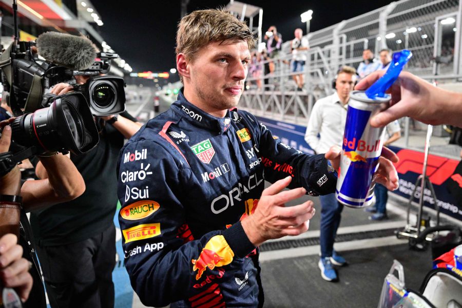 Red Bull Racing's Dutch driver Max Verstappen (C) is handed a drink after the qualifying session ahead of the Qatari Formula One Grand Prix at the Lusail International Circuit on October 6, 2023. - AFP Pic