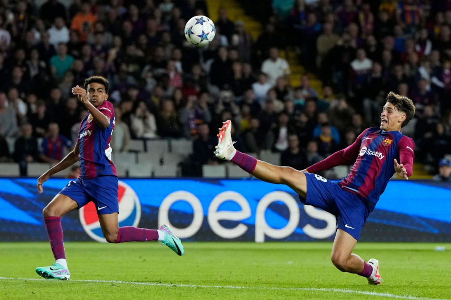 Barcelona's Spanish forward #38 Marc Guiu (R) tries to kick the ball next to Barcelona's Spanish forward #27 Lamine Yamal during the UEFA Champions League 1st round Group H football match between FC Barcelona and Shakhtar Donetsk. - AFP Pic