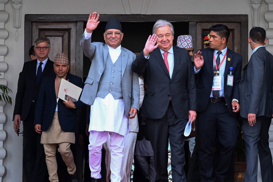United Nations Secretary General Antonio Guterres (C, right) along with Nepal's Prime Minister Pushpa Kamal Dahal (C, left) waves after a meeting during his four-day official visit, in Kathmandu on October 29, 2023. - AFP PIC