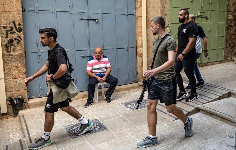 An Israeli off duty soldier walks with a riffle in the Old City of Jerusalem on November 2, 2023. - AFP Pic