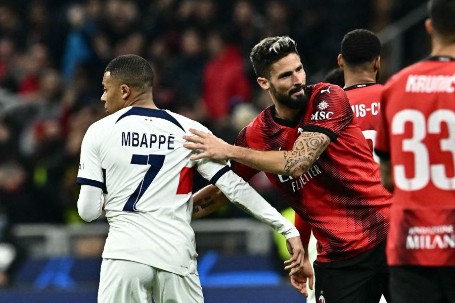 AC Milan's French forward #09 Olivier Giroud (R) greets Paris Saint-Germain's French forward #07 Kylian Mbappe after winning 2-1 the UEFA Champions League 1st round group F football match between AC Milan and Paris Saint-Germain.- AFP Pic