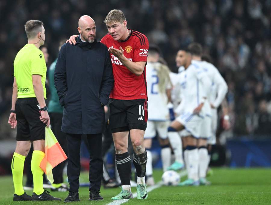 Manchester United's Danish striker Rasmus Hojlund (R) is suffering from a muscle strain. - AFP PIC