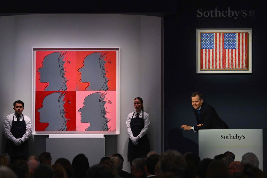 Sotheby's auctioneer Oliver Barker takes bids for Andy Warhol's "The Shadow" during Sotheby's auction of Emily Fisher Landau collection, including Picasso's "Femme à la montre" in New York City. - AFP Pic