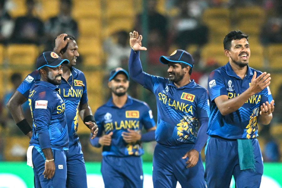 Sri Lanka's Angelo Mathews (2L) celebrates with teammates after taking the wicket of New Zealand's Mark Chapman during the 2023 ICC Men's Cricket World Cup one-day international (ODI) match between New Zealand and Sri Lanka on November 9, 2023. - AFP Pic