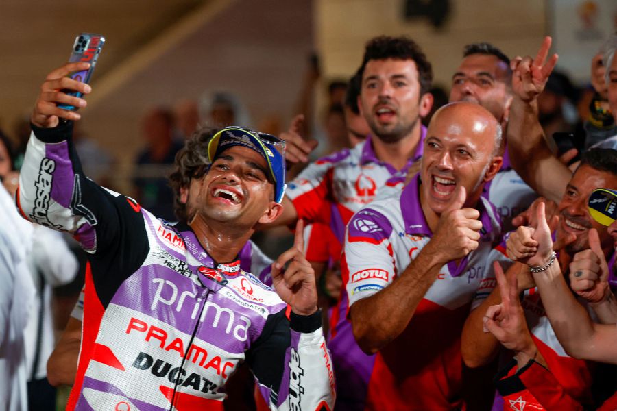Prima Pramac's Spanish rider Jorge Martin takes a selfie with his team after winning the Tissot Sprint race ahead of the Moto GP Grand Prix of Qatar at the Lusail International Circuit on November 18, 2023.- AFP Pic