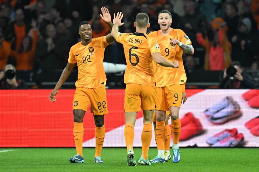 Netherlands' forward Wout Weghorst (R) celebrates with Netherlands' defender Denzel Dumfries (L) after scoring his team's first goal during the UEFA EURO 2024 Group B qualifying football match between Netherlands and Ireland. - AFP Pic