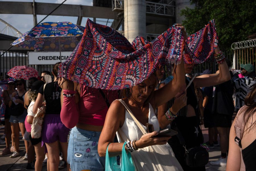 Fans of US singer Taylor Swift queue outside the Nilton Santos Olympic Stadium before Swift's concert, "Taylor Swift: The Eras Tour", amid a heat wave in Rio de Janeiro on November 18, 2023. - AFP Pic