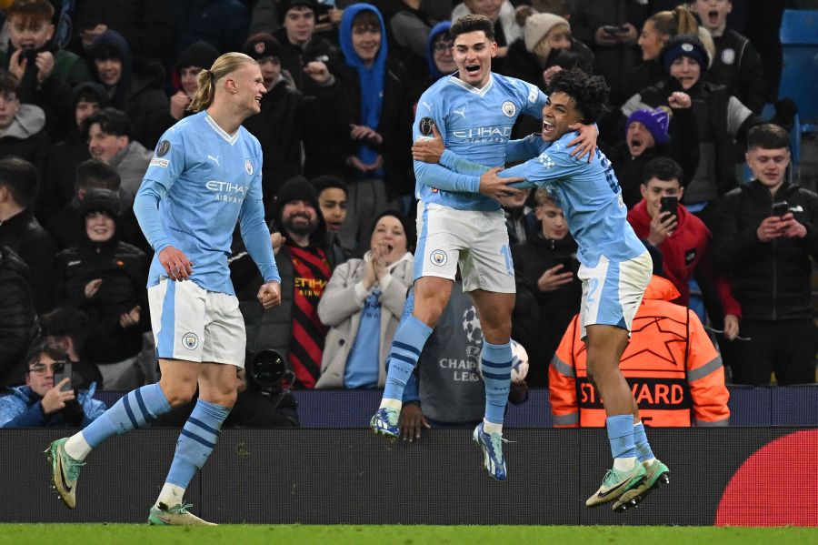 Manchester City's Argentinian striker #19 Julian Alvarez (C) celebrates scoring the team's third goal with Manchester City's Norwegian striker #09 Erling Haaland (L) and Manchester City's English defender #82 Rico Lewis during the UEFA Champions League Group G football match between Manchester City and RG Leipzig. - AFP Pic