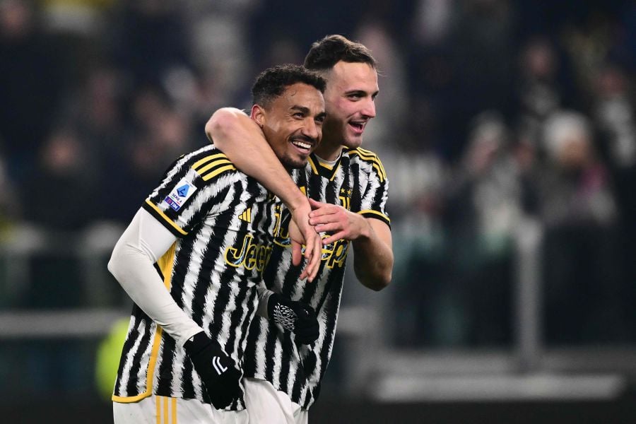 Juventus' Italian defender #04 Federico Gatti and Juventus' Brazilian defender #06 Danilo celebrate after winning the Italian Serie A football match between Juventus and Napoli, at The Allianz Stadium, in Turin on December 8, 2023. - AFP pic