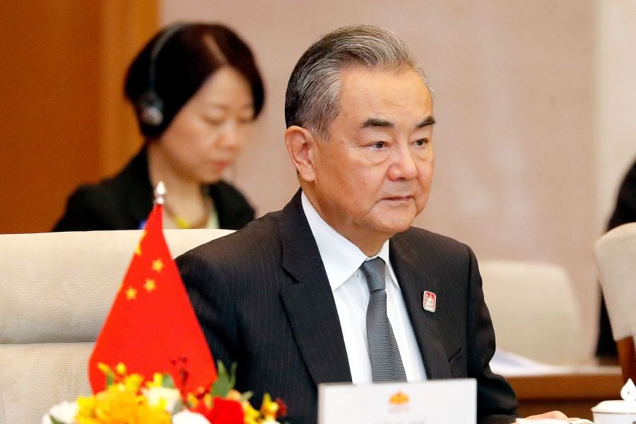 Chinese Foreign Minister Wang Yi is set to undertake a four-day official visit to Thailand from tomorrow to Jan 29, aimed at strengthening bilateral ties and signing a mutual visa exemption agreement. (Photo by MINH HOANG / POOL / AFP)