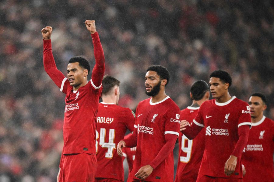 Liverpool's Dutch striker #18 Cody Gakpo celebrates after scoring his team third goal during the English League Cup quarter-final football match between Liverpool and West Ham United at Anfield in Liverpool, north west England on December 20, 2023.- AFP pic