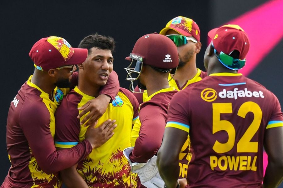 Gudakesh Motie (2nd L) and Shai Hope (L) of the West Indies celebrate the dismissal of Phil Salt of England during the 5th T20I between the West Indies and England at Brian Lara Cricket Academy Stadium in Tarouba, Trinidad and Tobago, on December 21, 2023.- AFP pic
