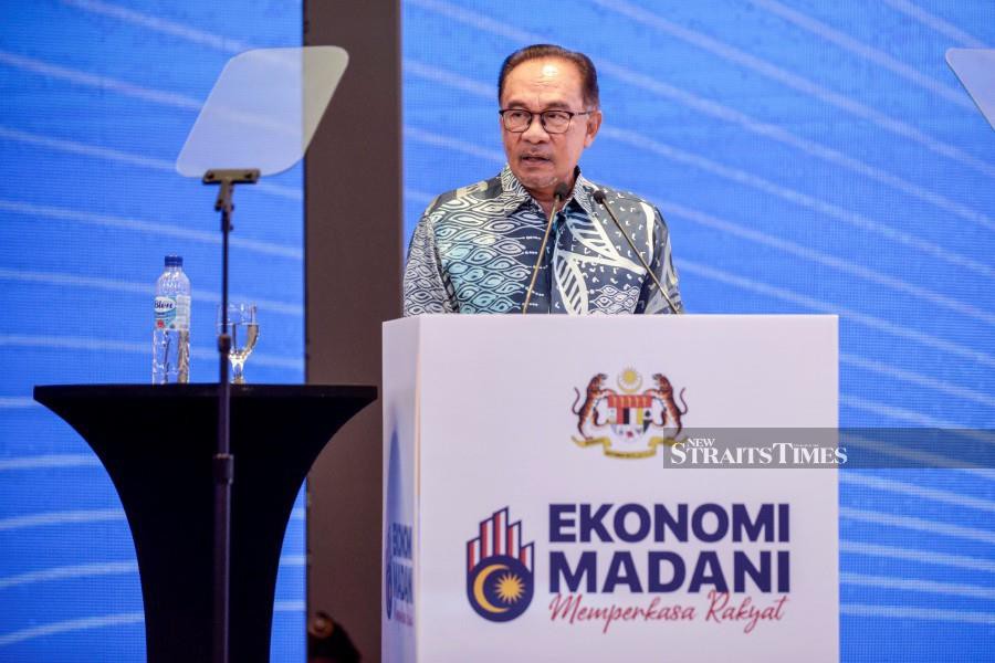 Prime Minister Datuk Seri Anwar Ibrahim speaking at the unveiling of the “Madani Economy: Empowering the People” framework. NSTP/AIZUDDIN SAAD