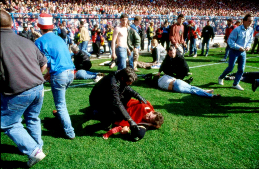 Stewards and supporters tend and care for wounded supporters on the field at Hillsborough Stadium, in Sheffield, England, April 15, 1989. - AP Pic