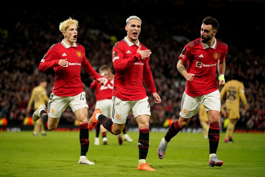 Manchester United's Antony, center, celebrates after scoring his side's second goal during the Europa League playoff second leg soccer match between Manchester United and Barcelona at Old Trafford stadium in Manchester. - AP Pic