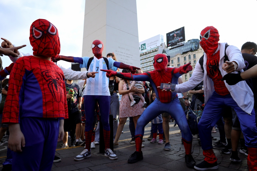 People dressed as Spider-Man point at each other at a Spider-Man cosplayers' gathering, organised in an attempt to set a Guinness World Record for the largest gathering of people dressed as Spider-Man, in Buenos Aires, Argentina. (REUTERS/Cristina Sille)