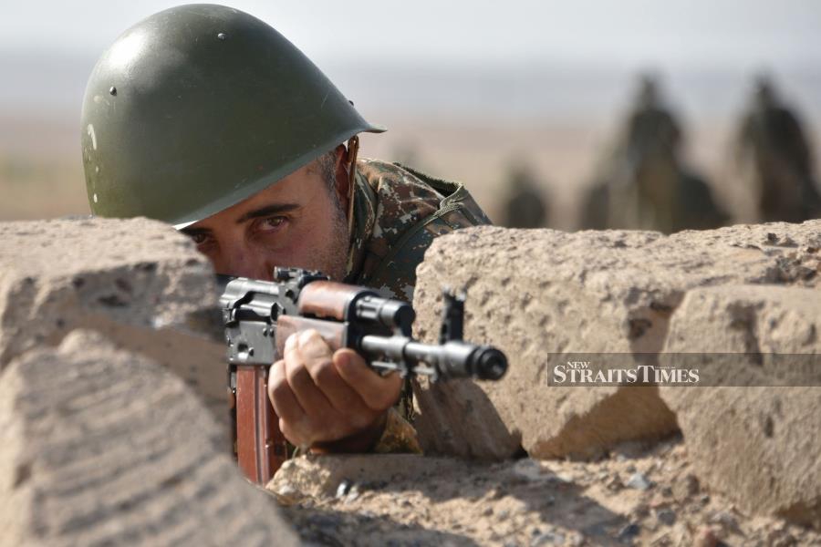 Reservists undergo a military training before leaving for the frontline in Nagorno-Karabakh, at a range in Armenia's Armavir region yesterday. Armenia and Azerbaijan have for three decades been locked in a conflict over Azerbaijan's Armenian-populated mountainous Karabakh province. (Photo by Karen MINASYAN / AFP)