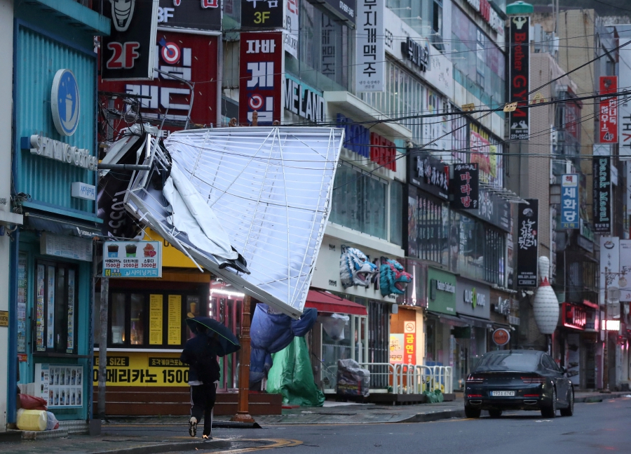 A signboard is seen damaged by Typhoon Hinnamnor in Changwon, South Korea. (Photo by Yonhap/via REUTERS) 