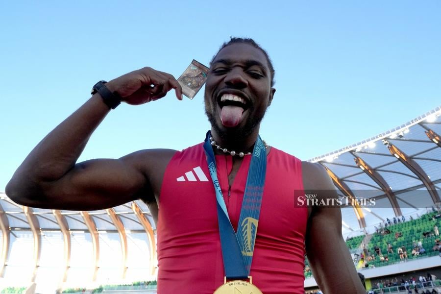 Noah Lyles poses with gold medal after winning the 100m in 9.83 during the US Olympic Team Trials at Hayward Field on Sunday. USA TODAY SPORTS PIC 