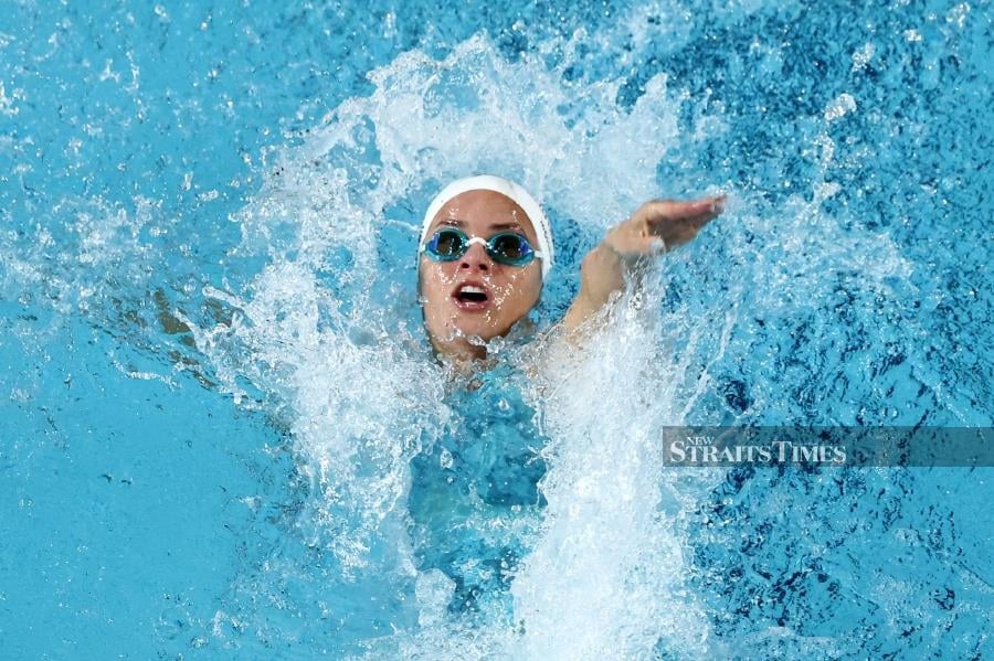 Australia’s Kaylee McKeown competes in the women’s 100m backstroke heats during the Australian Swimming Trials at the Brisbane Aquatic Centre on Tuesday. AFP PIC 
