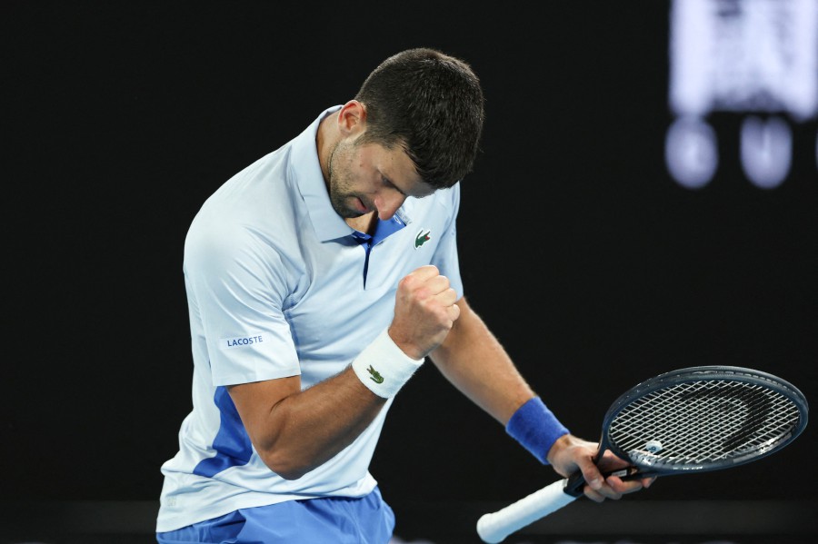 Serbia's Novak Djokovic reacts after a point against France's Adrian Mannarino during their men's singles match on day eight of the Australian Open tennis tournament in Melbourne. - AFP pic