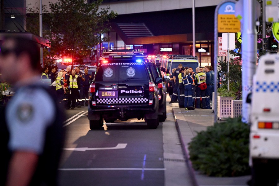 Emergency service workers work at the scene at Bondi Junction after multiple people were stabbed inside the eastern suburbs shopping centre in Sydney, April 13, 2024. - AAP Image/Bianca De Marchi via REUTERS 