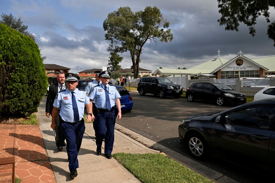 (FILE PHOTO) Police depart the Assyrian Christ The Good Shepherd Church after a knife attack took place during a service on Monday night, in Wakeley, Sydney, Australia. (REUTERS/ Jaimi Joy/File Photo)