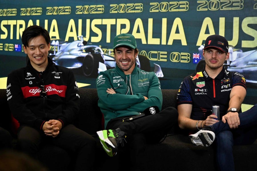 Formula 1 drivers, Red Bull Racing's Dutch driver Max Verstappen (R), Aston Martin's Spanish driver Fernando Alonso (C) and Alfa Romeo's Chinese driver Zhou Guanyu, attend a press conference ahead of the 2023 Formula One Australian Grand Prix at the Albert Park Circuit in Melbourne on March 30, 2023. -AFP PIC