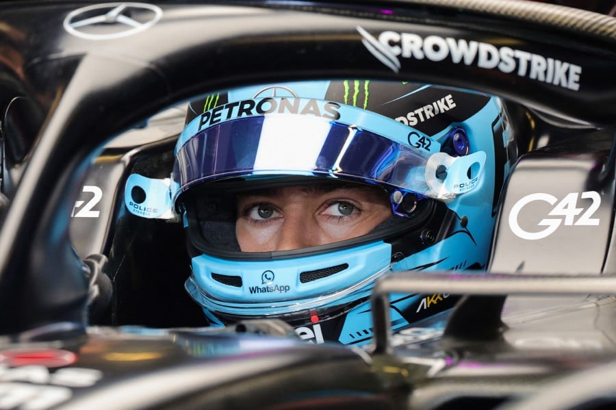 Mercedes' British driver George Russell sits in his car during the third practice session for the Abu Dhabi Formula One Grand Prix at the Yas Marina Circuit in the Emirati city. - AFP pic
