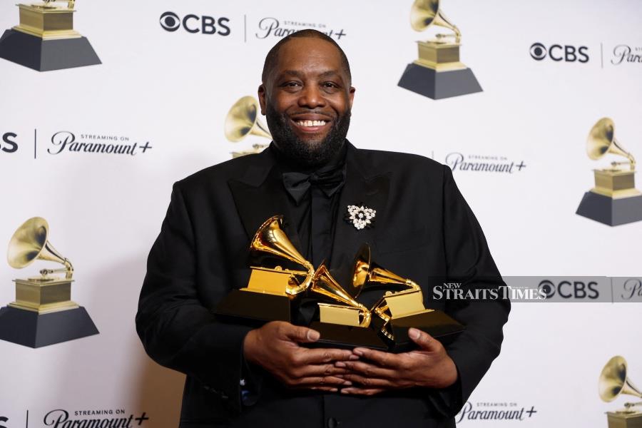 Killer Mike poses with the Best Eap Album award, the Best Rap Performance award and the Best Rap Song award at the 66th Annual Grammy Awards in Los Angeles, California, U.S. (REUTERS/David Swanson)