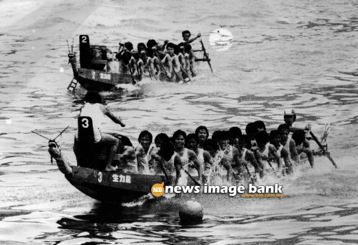 16 June 1981: Hong Kong's Sai Kung team crosses the line as the Penang team, the 1st runner up, races towards the finish of the 4th International Dragon Boat Races.