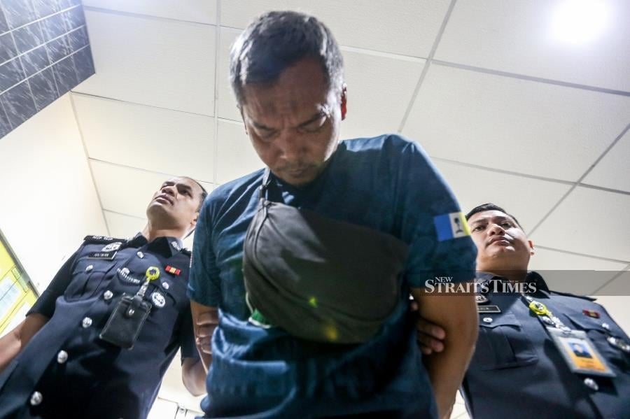 Azman Md Yusof claimed trial when the charge was read to him by the court interpreter before Judge Noor Aini Yusof. - NSTP/DANIAL SAAD