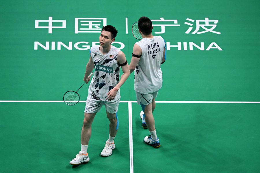 Aaron Chia and Soh Wooi Yik compete against compatriots Goh Sze Fei and Nur Izzuddin during their men's doubles semi-final match at the Badminton Asia Championships in Ningbo, in eastern China's Zhejiang province on April 13, 2024. - AFP pic