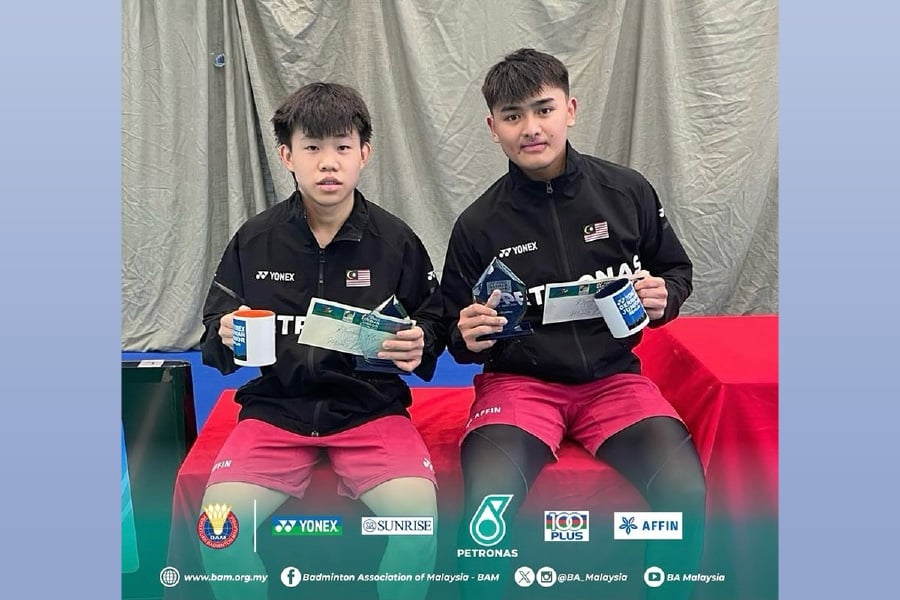 Aaron Tai (left)-Kang Khai Xing with their prizes at the German Juniors in Berlin on Sunday. - Pic courtesy from BAM 