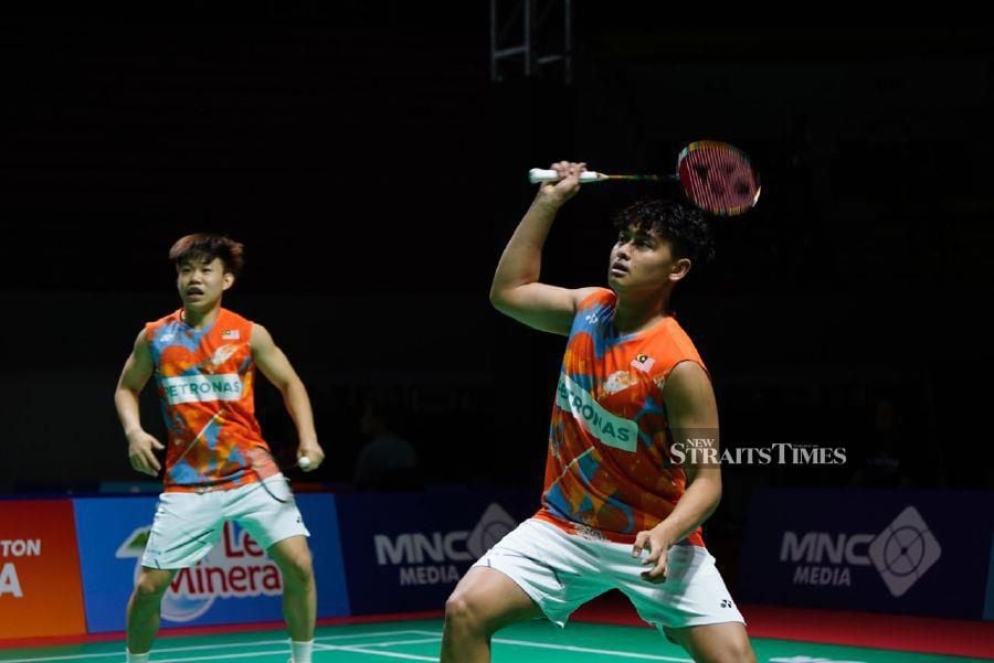Malaysia’s Aaron Tai (left)-Kang Khai Xing in action against Macau’s Chio Chi Seng-Ou Ka Hou during Friday’s Badminton Asia Junior Mixed Team Championships Group B tie in Yogyakarta, Indonesia. PIC FROM BAM 